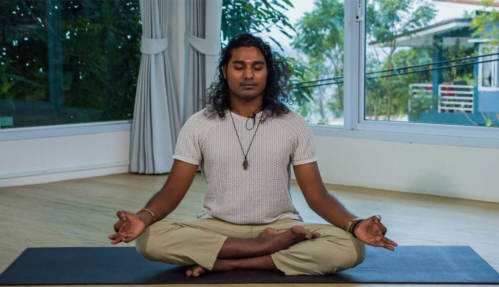 Aravind meditating, representing meditation as a way of living.